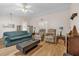 Living room featuring a teal sofa, two armchairs, and a coffee table at 2712 Ceram Ave, Orlando, FL 32837