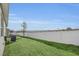 Landscaped backyard with white fence at 283 Archer Way, Haines City, FL 33844