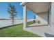 Covered patio, fenced backyard, and green lawn at 283 Archer Way, Haines City, FL 33844