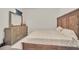Spacious bedroom with wood bed frame and dresser at 283 Archer Way, Haines City, FL 33844