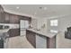 Modern kitchen with granite countertops and dark cabinetry at 283 Archer Way, Haines City, FL 33844