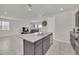 Open concept kitchen and living area with tile floors at 283 Archer Way, Haines City, FL 33844