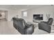 Spacious living room with a large TV and comfortable seating at 283 Archer Way, Haines City, FL 33844