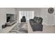Living room with reclining furniture and large TV at 283 Archer Way, Haines City, FL 33844