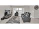 Living room with reclining furniture and large TV at 283 Archer Way, Haines City, FL 33844