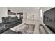 Living room with sectional sofa and large TV at 283 Archer Way, Haines City, FL 33844