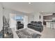 Open concept living room and kitchen with patio access at 283 Archer Way, Haines City, FL 33844
