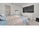 Main bedroom with large TV and ensuite bathroom at 283 Archer Way, Haines City, FL 33844