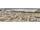 Aerial view of community, showcasing lakefront location and numerous homes at 3037 Cassidy Ln, Haines City, FL 33844