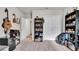 Bedroom with a guitar, built-in shelving, and closet at 3037 Cassidy Ln, Haines City, FL 33844