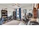 Cozy bedroom with built-in shelving, gaming setup, and pet bed at 3037 Cassidy Ln, Haines City, FL 33844