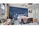 Bedroom with dark blue accent wall and window with natural light at 3037 Cassidy Ln, Haines City, FL 33844