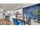 Kitchen with adjacent dining area, featuring a dark wood table and blue chairs at 3037 Cassidy Ln, Haines City, FL 33844