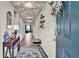 Bright entryway with decorative ceiling and hardwood floors at 3037 Cassidy Ln, Haines City, FL 33844