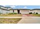 One-story house with solar panels and a brick driveway at 3037 Cassidy Ln, Haines City, FL 33844