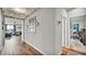Bright hallway with cloud-themed decor, leading to living room and office at 3037 Cassidy Ln, Haines City, FL 33844