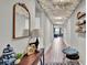 Elegant hallway with decorative mirror and charming decor at 3037 Cassidy Ln, Haines City, FL 33844