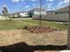 Newly seeded backyard featuring a young tree, complemented by neighboring houses at 329 Conway Ave, St Cloud, FL 34771