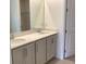 Bathroom with a double sink vanity, light-colored cabinets, and modern faucets at 329 Conway Ave, St Cloud, FL 34771