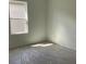 Unfurnished bedroom with a window and floors covered with plastic at 329 Conway Ave, St Cloud, FL 34771