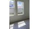 Bright bedroom with two large windows offering natural light and neighborhood views at 329 Conway Ave, St Cloud, FL 34771