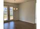 Bright dining area featuring wood flooring, chandelier, and French doors at 329 Conway Ave, St Cloud, FL 34771