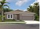 One-story home with a two-car garage and attractive landscaping at 329 Conway Ave, St Cloud, FL 34771