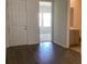 Foyer features wood flooring and a view to a guest bath and bedroom at 329 Conway Ave, St Cloud, FL 34771