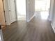 Open-concept living room features wood flooring and seamless access to the kitchen at 329 Conway Ave, St Cloud, FL 34771