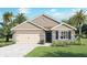 New home exterior boasts stone accents and a two-car garage at 33464 Copper Hill Way, Sorrento, FL 32776