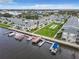 Aerial view of waterfront condo community with boat slips and recreational areas at 335 N Causeway # C23, New Smyrna Beach, FL 32169