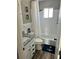 Clean bathroom with granite vanity and a tub shower at 335 N Causeway # C23, New Smyrna Beach, FL 32169