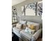 Living room with couch and decorative pillows at 335 N Causeway # C23, New Smyrna Beach, FL 32169
