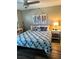 Main bedroom with comfortable bed and nautical-themed decor at 335 N Causeway # C23, New Smyrna Beach, FL 32169