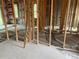 Interior framing and concrete flooring of new construction home at 339 Camellia Ct, Kissimmee, FL 34759