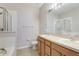 Double vanity bathroom with light wood cabinets and a shower at 4052 Falling Lilly Ct, Winter Springs, FL 32708