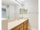 Bathroom with single sink vanity and mirror at 4052 Falling Lilly Ct, Winter Springs, FL 32708