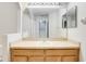 Bathroom with single sink vanity and large mirror at 4052 Falling Lilly Ct, Winter Springs, FL 32708