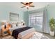 Bedroom with light wood bed frame and window at 4052 Falling Lilly Ct, Winter Springs, FL 32708