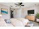 Bedroom with a light wood dresser and neutral bedding at 4052 Falling Lilly Ct, Winter Springs, FL 32708