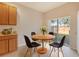 Kitchen breakfast nook with a round wooden table and four chairs at 4052 Falling Lilly Ct, Winter Springs, FL 32708