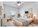 Bright bedroom with a light wood bed frame and neutral decor at 4052 Falling Lilly Ct, Winter Springs, FL 32708