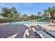 Community pool with lounge chairs at 4052 Falling Lilly Ct, Winter Springs, FL 32708