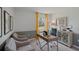Bright home office features a desk, two chairs, and built-in shelving at 4241 Singing Mockingbird Blvd, Bartow, FL 33830
