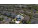 An aerial view showing a home's location within a community near marshland at 445 Kestrel Dr, Groveland, FL 34736