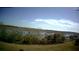 Aerial view showing property and surrounding wetlands at 445 Kestrel Dr, Groveland, FL 34736