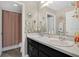 Bright bathroom with double sink vanity and a shower and bathtub combination at 445 Kestrel Dr, Groveland, FL 34736