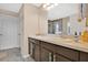 Well-lit bathroom featuring double sinks, ample counter space, and modern fixtures at 445 Kestrel Dr, Groveland, FL 34736