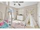 Cozy bedroom with a teepee, soft rug, and cute decor at 445 Kestrel Dr, Groveland, FL 34736