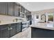 Well-equipped kitchen featuring stainless steel appliances, bright counters, and ample cabinet space at 445 Kestrel Dr, Groveland, FL 34736